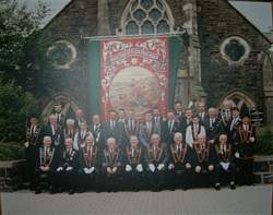 Members of RBP 199 siting at the unfurling ofa new banner 